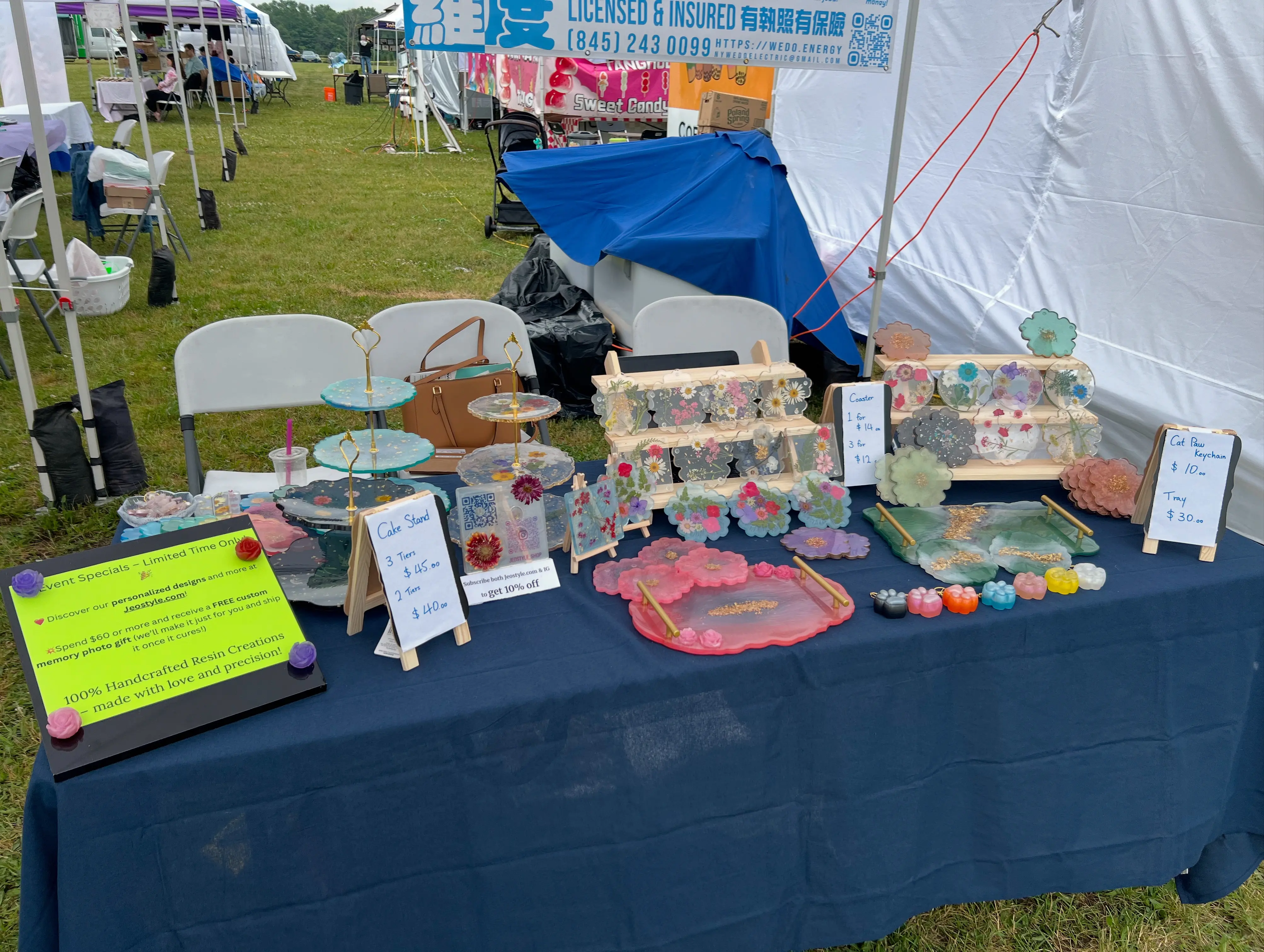 The Jeostyle booth at a local market, filled with resin coasters and trays
